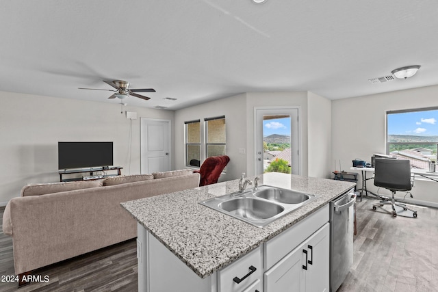 kitchen with sink, dark wood-type flooring, white cabinetry, a center island with sink, and stainless steel dishwasher