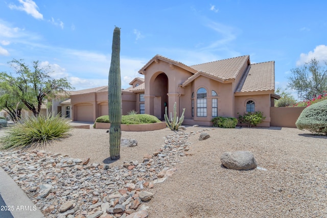 12605 E Kalil Dr, Scottsdale, AZ 85259 - mediterranean / spanish home with a garage, stucco siding, and a tiled roof