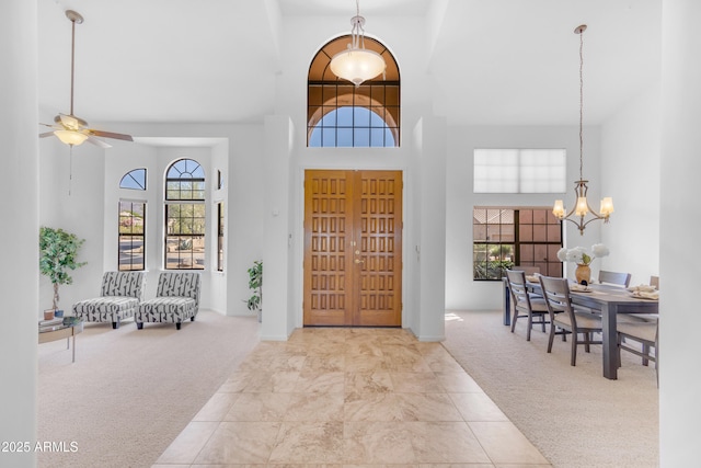 12605 E Kalil Dr, Scottsdale, AZ 85259 - carpeted foyer entrance featuring a towering ceiling, a chandelier, and ceiling fan