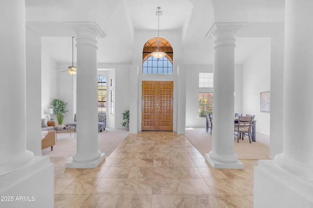 12605 E Kalil Dr, Scottsdale, AZ 85259 - foyer entrance with decorative columns, a high ceiling, and ceiling fan