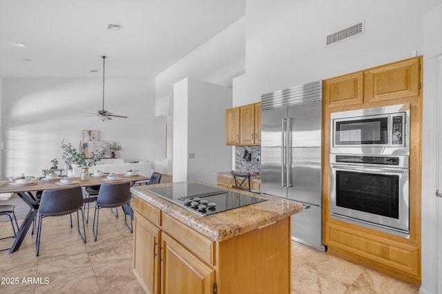 12605 E Kalil Dr, Scottsdale, AZ 85259 - kitchen with built in appliances, high vaulted ceiling, a kitchen island, ceiling fan, and backsplash