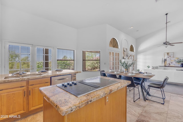 12605 E Kalil Dr, Scottsdale, AZ 85259 - kitchen featuring black electric cooktop, stainless steel dishwasher, a high ceiling, a kitchen island, and a ceiling fan