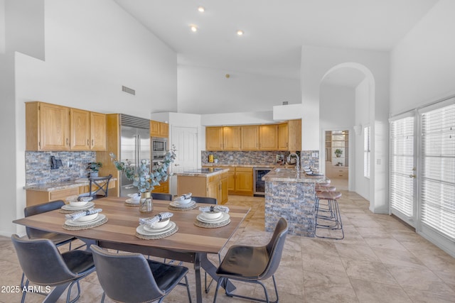 12605 E Kalil Dr, Scottsdale, AZ 85259 - dining area featuring beverage cooler and high vaulted ceiling
