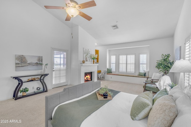 12605 E Kalil Dr, Scottsdale, AZ 85259 - carpeted living area with healthy amount of natural light, a tile fireplace, a ceiling fan, and high vaulted ceiling