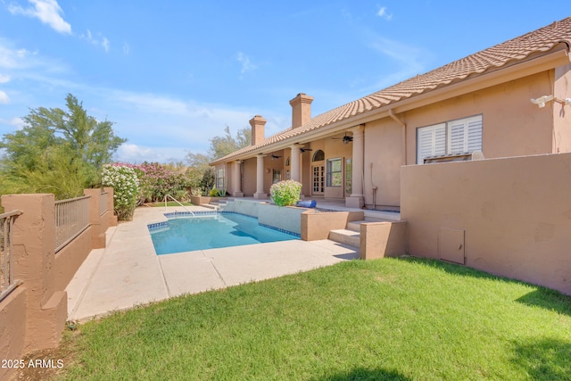 12605 E Kalil Dr, Scottsdale, AZ 85259 - view of pool with a ceiling fan, a patio area, and a lawn
