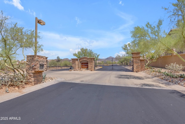 12605 E Kalil Dr, Scottsdale, AZ 85259 - view of concrete road with a gate and a gated entry