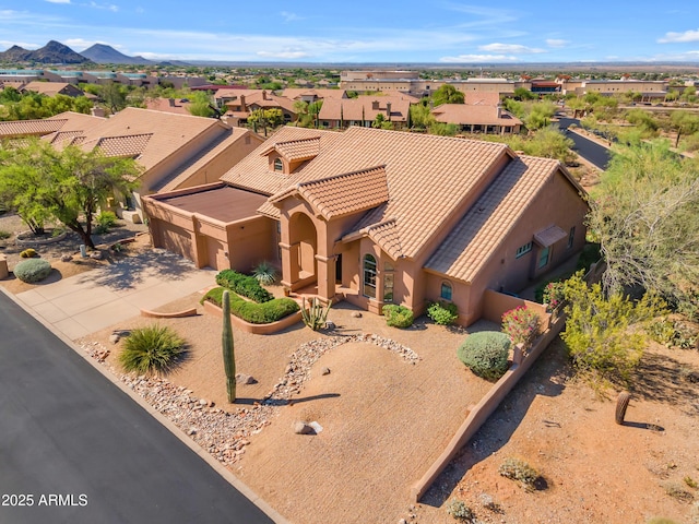 12605 E Kalil Dr, Scottsdale, AZ 85259 - view of front of house featuring a tile roof, an attached garage, driveway, stucco siding, and a residential view