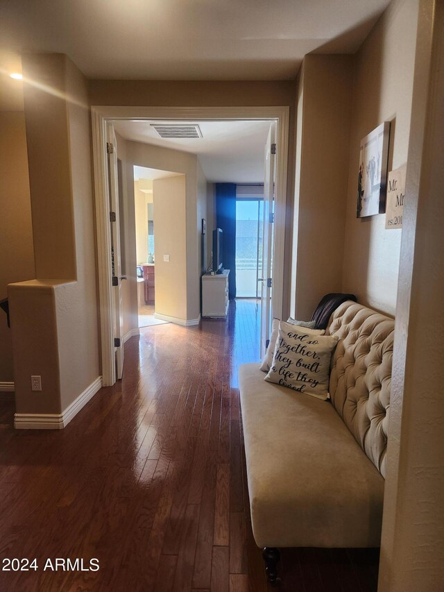 hall with dark hardwood / wood-style floors