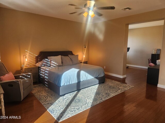 bedroom featuring ceiling fan and dark hardwood / wood-style floors