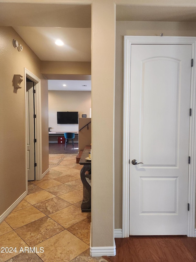 hall with hardwood / wood-style flooring