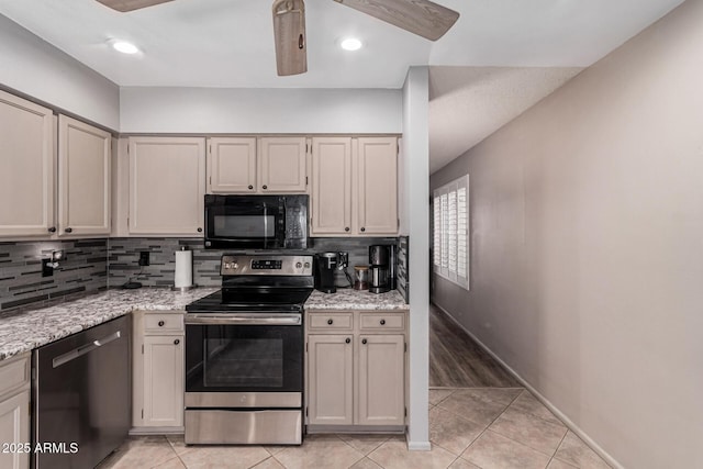 kitchen with appliances with stainless steel finishes, tasteful backsplash, light tile patterned floors, ceiling fan, and light stone counters