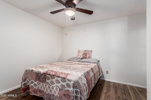 bedroom with dark wood-type flooring and ceiling fan