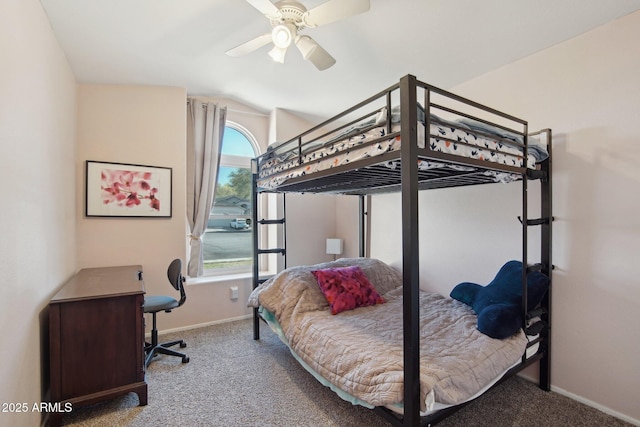 carpeted bedroom featuring ceiling fan and vaulted ceiling