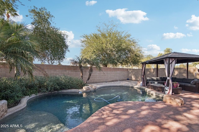 view of swimming pool with an outdoor living space and a gazebo