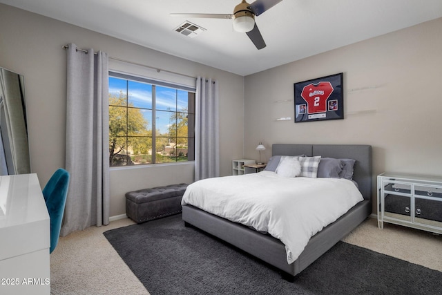 bedroom featuring visible vents, ceiling fan, and carpet flooring