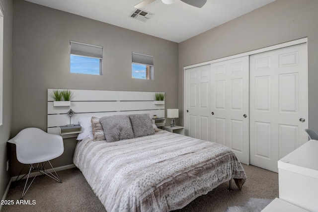 bedroom featuring carpet flooring, baseboards, visible vents, and a closet