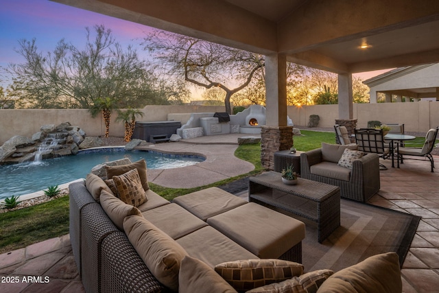 view of patio / terrace featuring outdoor dining space, an outdoor living space, a fenced backyard, and a fenced in pool