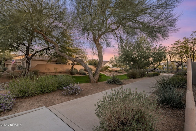 view of property's community featuring fence