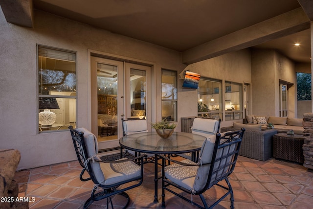 view of patio featuring an outdoor living space, french doors, and outdoor dining space