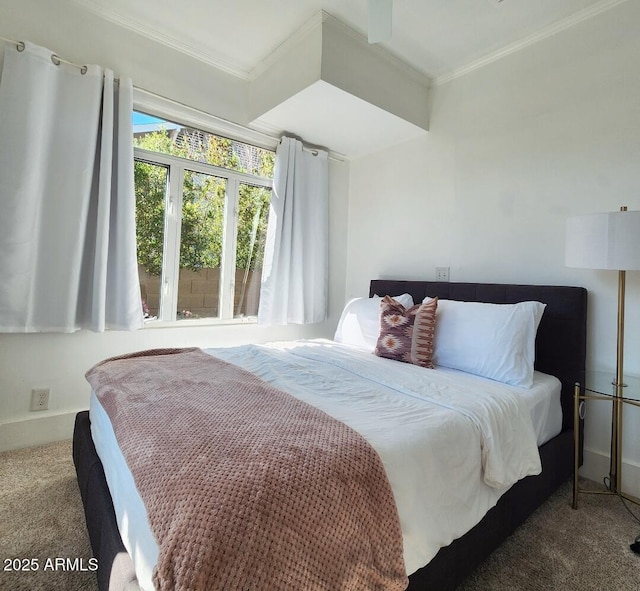 bedroom featuring baseboards, carpet, and crown molding