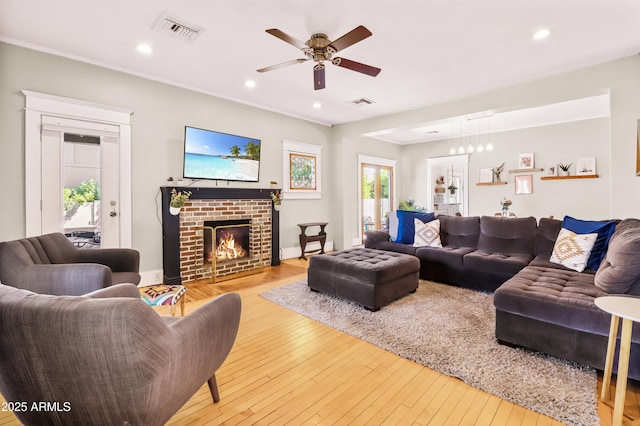 living room featuring visible vents, recessed lighting, ceiling fan, and hardwood / wood-style floors