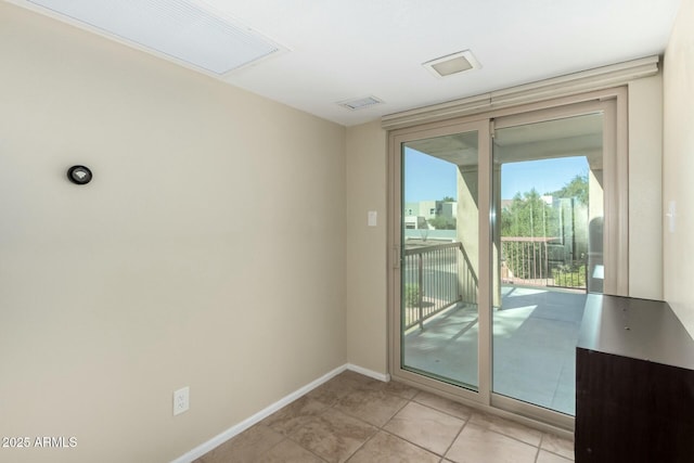 entryway with light tile patterned floors, baseboards, and visible vents