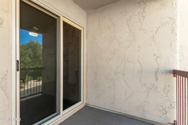 property entrance featuring stucco siding