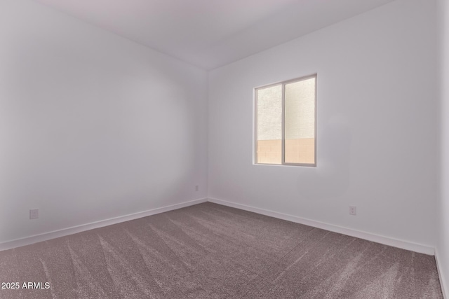 20274 W Monterey Way, Buckeye, AZ 85396 - unfurnished room with dark carpet and baseboards