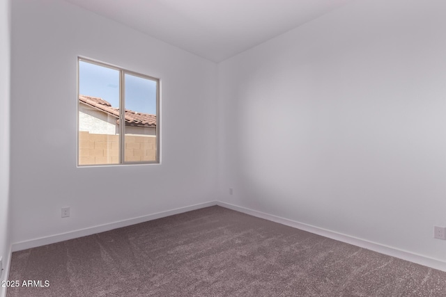 20274 W Monterey Way, Buckeye, AZ 85396 - empty room with dark carpet and baseboards