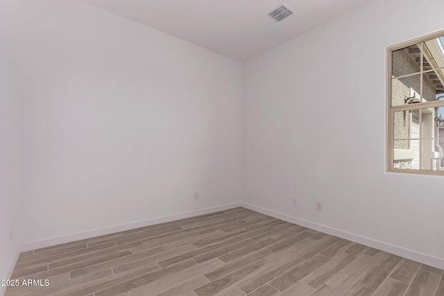 20274 W Monterey Way, Buckeye, AZ 85396 - empty room with light wood-style flooring and baseboards