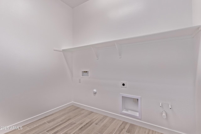 20274 W Monterey Way, Buckeye, AZ 85396 - laundry room with hookup for a gas dryer, hookup for a washing machine, light wood-type flooring, and electric dryer hookup