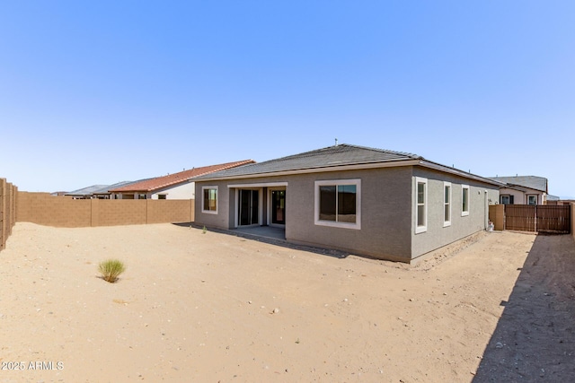 20274 W Monterey Way, Buckeye, AZ 85396 - rear view of house featuring a fenced backyard and stucco siding
