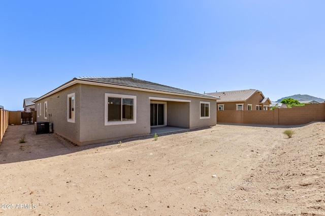 20274 W Monterey Way, Buckeye, AZ 85396 - back of house featuring a fenced backyard and a patio