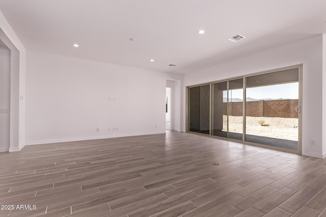 20274 W Monterey Way, Buckeye, AZ 85396 - unfurnished room featuring wood finished floors and recessed lighting