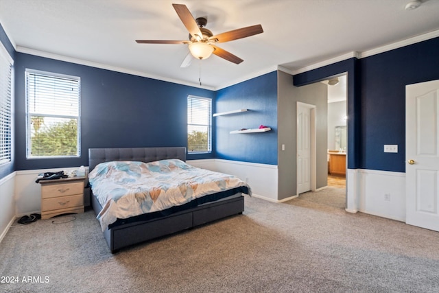 bedroom with multiple windows, light carpet, ceiling fan, and crown molding