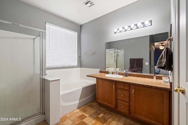 bathroom with independent shower and bath and vanity