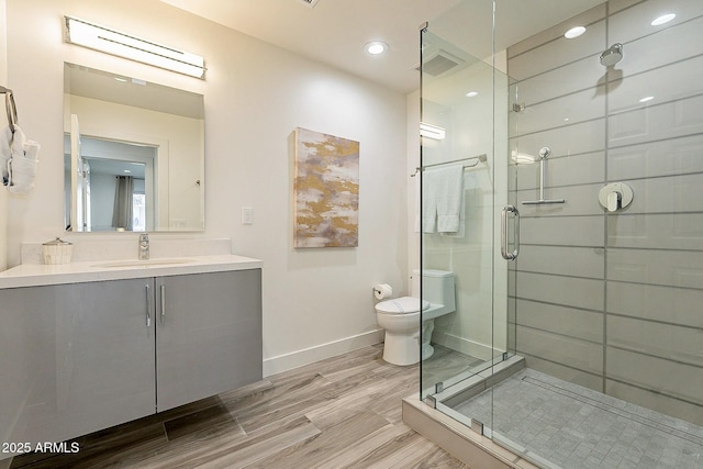 1911 E Claremont St, Phoenix, AZ 85016 - full bathroom with visible vents, vanity, toilet, baseboards, and a stall shower