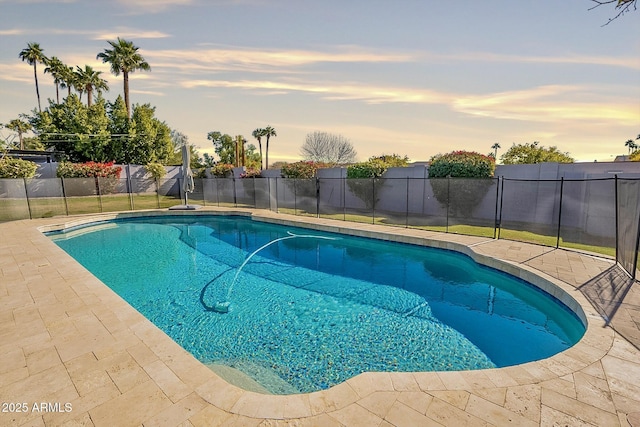 1911 E Claremont St, Phoenix, AZ 85016 - pool at dusk featuring a fenced in pool, a fenced backyard, and a patio area