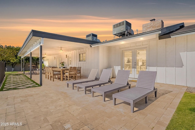 1911 E Claremont St, Phoenix, AZ 85016 - view of patio with outdoor dining area, central AC, and french doors