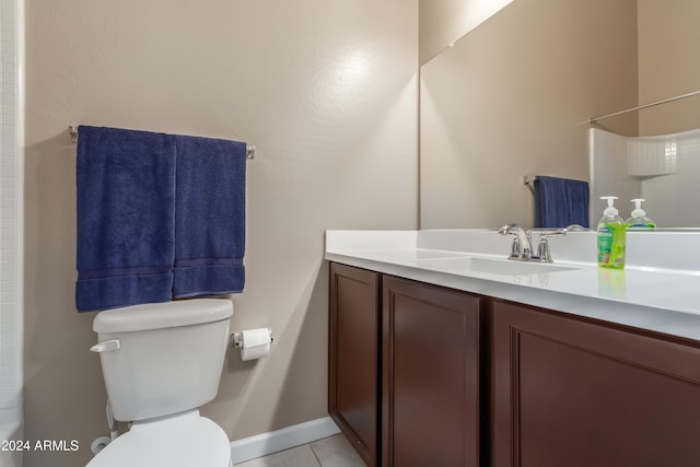 bathroom featuring vanity, toilet, and tile patterned floors