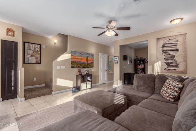 tiled living room with ceiling fan