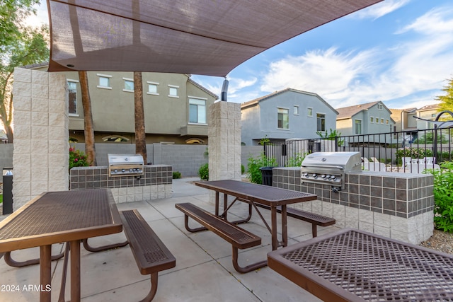 view of patio featuring a grill and an outdoor kitchen