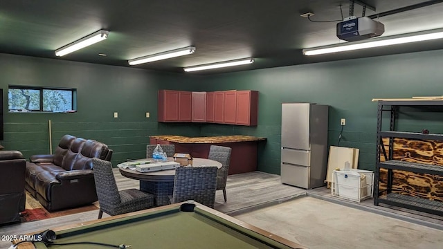 interior space featuring light wood-type flooring and pool table
