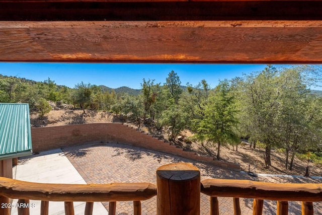 view of patio featuring a forest view