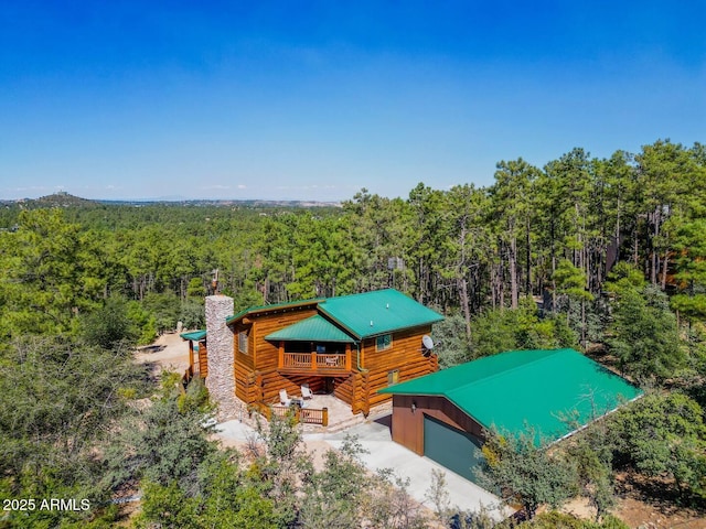 aerial view featuring a forest view