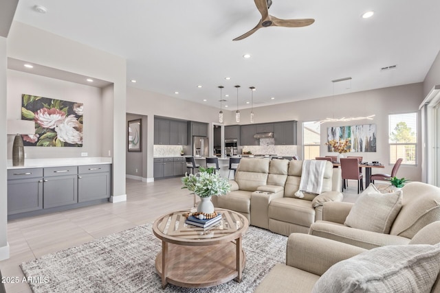 living room with ceiling fan