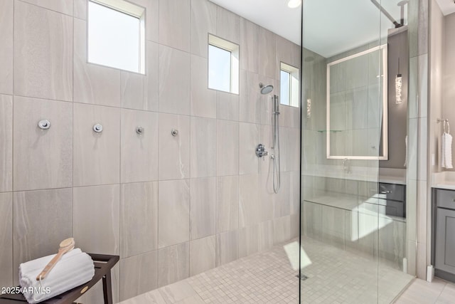 bathroom featuring vanity and a tile shower