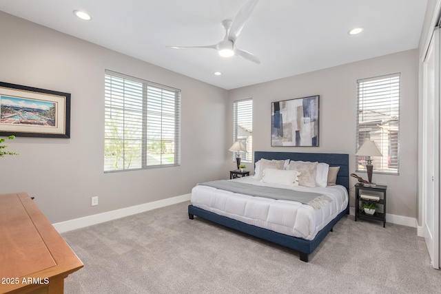 bedroom featuring light carpet and ceiling fan