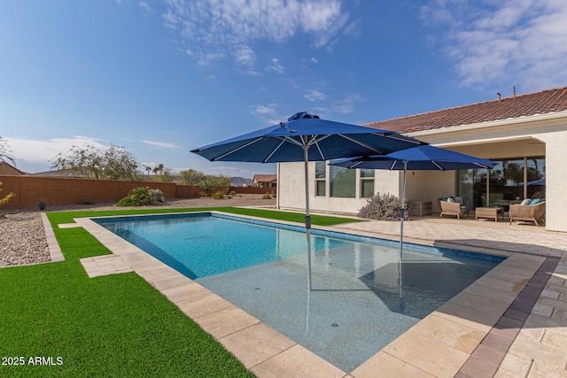 view of pool featuring a patio area