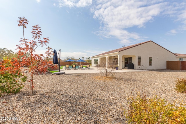 rear view of property with a patio